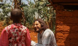 Catholic actor Jonathan Roumie visits Emelyne, a little girl he has sponsored since 2023, in Rwanda. / Credit: Unbound