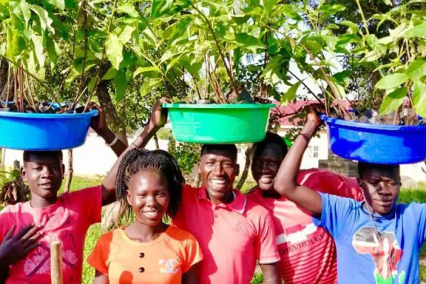 Youth at Don Bosco Refugee Services, Palabek in Uganda's Catholic Archdiocese of Gulu during a tree planting session at the refugee center on 16 August  2021. Credit: Fr. Lazar Arasu