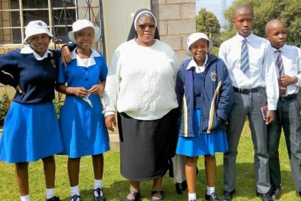 Sr. Augustina (center) with students of Mazenod High School in Maseru, Lesotho. / African Sisters Education Collaborative (ASEC).