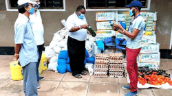 Members of the Catholic Justice and Peace Commission (CJPC) of Kenya's Malindi Diocese preparing to distribute food items and liquid handwashing soap to vulnerable families. / Catholic Diocese of Malindi/CJPC