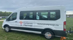 Small white vans dubbed "monstrance mobiles" are being used for the National Eucharistic Pilgrimage. They are just big enough for some of the "perpetual pilgrims" and a pedestal upon which Christ in the monstrance can be placed. / Credit: Jonathan Liedl/CNA