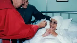 Mother María Berenice receives the Eucharist during a period of illness. Hermanitas de la Anunciación.