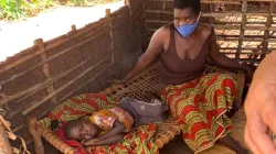 A mother and her child inside a doorless house in the Catholic Archdiocese of Nampula/ Credit: Denis Hurley Peace Institute