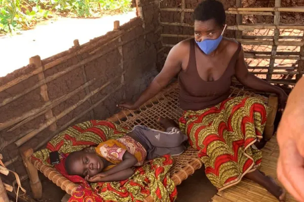 A mother and her child inside a doorless house in the Catholic Archdiocese of Nampula/ Credit: Denis Hurley Peace Institute