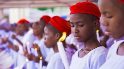 A group of school girls receiving the sacraments of baptism and confirmation in Onitsha, Anambra, Nigeria, on May 30, 2022. / Shutterstock