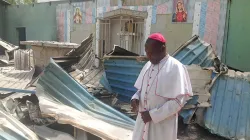 Bishop Oliver Doeme inspecting a burnt church in Bahuli, Maiduguri. Credit: ACN