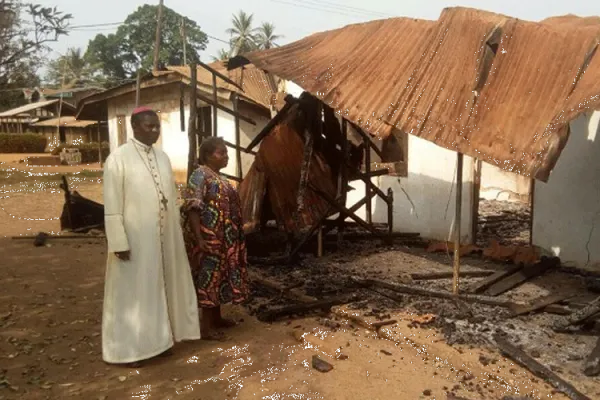 Archbishop Andrew Nkea Fuanya of Bamenda Archdiocese, sympathizing with a woman whose house was burnt down in the ongoing Anglophone crisis.
