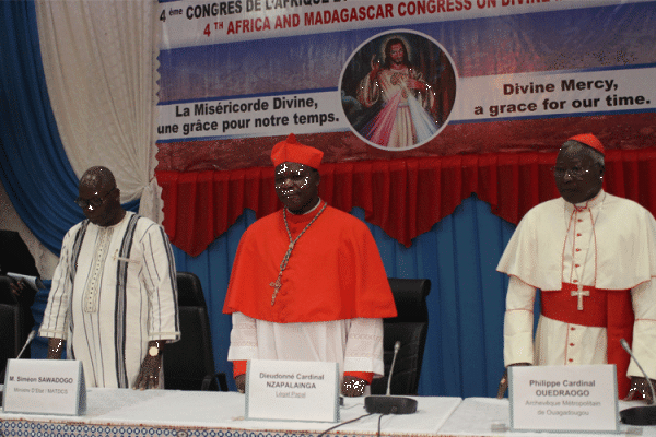 Dieudonne Cardinal Nzapalainga (Center), Philippe Cardinal Ouedraogo (Right), Simeon Sawado (Left), observing a minute of Silence for the victims  of terrorism in Burkina Faso, during the Opening Ceremony of the 4th Pan-African Congress on Divine Mercy in Ouagadougou on November 19, 2019 / ACI Africa