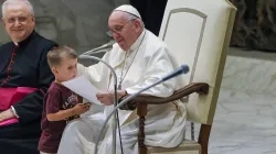 Pope Francis with a surprise visitor on stage at the General Audience in the Vatican on Aug. 17, 2022. Pablo Esparza / CNA