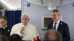 Pope Francis speaks aboard a Nov. 26 flight from Tokyo to Rome. Credit: Hannah Brockhaus/CNA