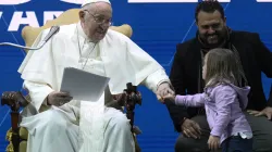 Pope Francis greets a young girl at a conference on Friday, May 10, 2024, on the state of birth rates in Italy and the wider West at the Auditorium della Conciliazione in Rome. / Credit: Vatican Media