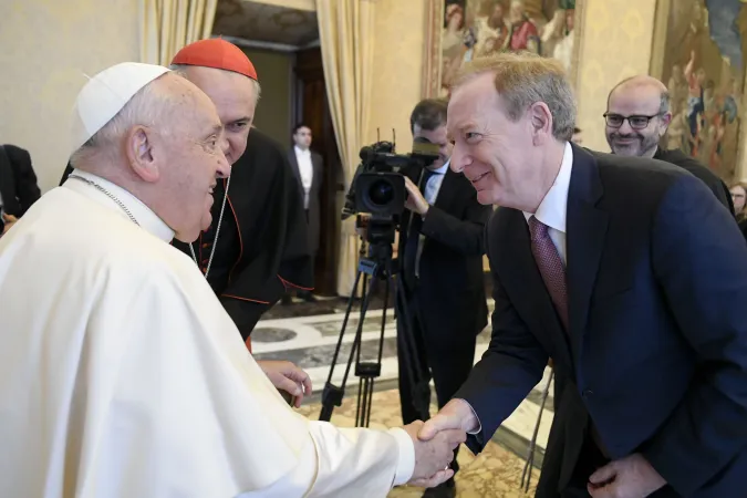 Pope Francis greets Microsoft President Brad Smith on Nov. 11, 2024, at the Vatican.