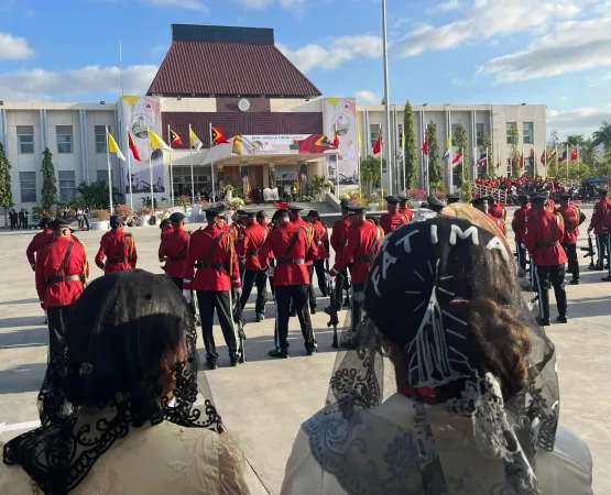 Women wear veils as they await the audience with the pope at the presidential palace in Dili, East Timor, on Sept. 9, 2024.