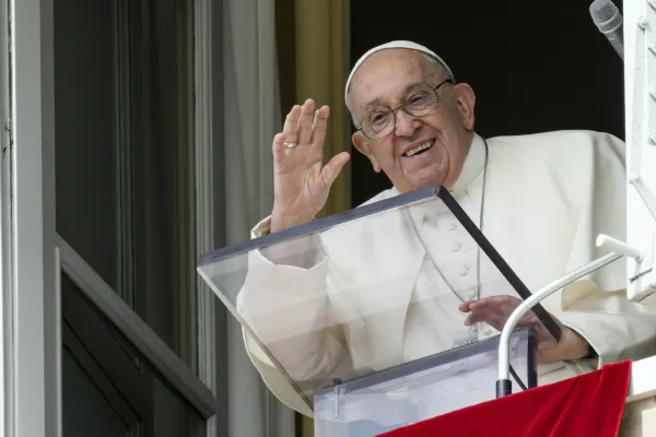 Pope Francis waves from a window of the Apostolic Palace at the crowds gathered in St. Peter's Square for his weekly Angelus address on Sunday, Sept. 22, 2024. / Credit: Vatican Media