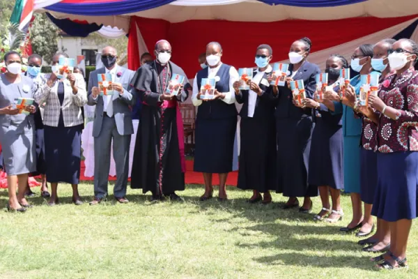 Archbishop Martin Kivuva Musonde of Kenya's Mombasa Archdiocese alongside Loreto Sisters displaying the new book, "Mary Ward - Her time is now" on 29 January 2022 at Loreto Convent Msongari. Credit: Sr. Santrina Tumusiime, IBVM