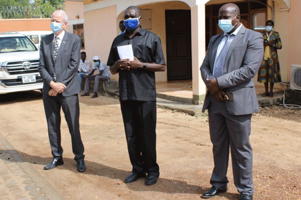 Fr. James Oyet Latansio (Center), UK ambassador Christopher Trott (left) and Christian Aid Country Director (right) after the launch  a helpline center for psychosocial and trauma healing of the people affected by COVID-19 in South Sudan. / ACI Africa