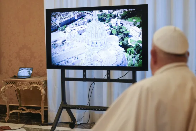 Pope Francis gets a preview of the new digital model of St. Peter’s Basilica during a meeting with the Microsoft team and the Fabric of St. Peter organization on Nov. 11, 2024.