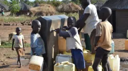 South Sudanese Refugees at a water point in Yoyo Zone II Bidibidi Refugees' Settlement. Credit: Rurugene