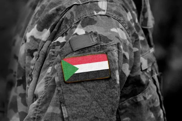 Flag of Sudan on soldier's arm. Credit: Bumble Dee/Shutterstock
