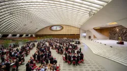 Synod on Synodality delegates seated at discussion tables inside Paul VI Hall at the Vatican in October 2023. | Credit: Daniel Ibáñez | CNA