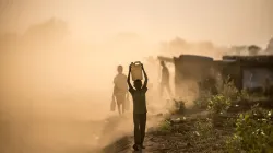 South Sudanese refugee children carry water through Bidi Bidi camp in Uganda. / Tommy Trenchard/ Trocaire