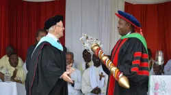 New Vice Chancellor Designate taking office at Kenya-based Tangaza University College (TUC): Left: Br. Tom Kearney, former Principal interim TUC handing over the Mace to Prof. David Wango'mbe on January 8, 2020 / Tangaza University College