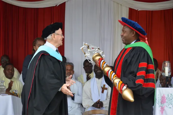 New Vice Chancellor Designate taking office at Kenya-based Tangaza University College (TUC): Left: Br. Tom Kearney, former Principal interim TUC handing over the Mace to Prof. David Wango'mbe on January 8, 2020 / Tangaza University College