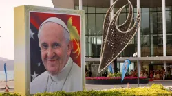 A smiling Pope Francis is depicted on a sign outside the APEC Haus in Port Moresby, Papua New Guinea, on the occasion of the pontiff's visit, Sept. 7, 2024. / Credit: Daniel Ibáñez/CNA