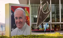 A smiling Pope Francis is depicted on a sign outside the APEC Haus in Port Moresby, Papua New Guinea, on the occasion of the pontiff's visit, Sept. 7, 2024. / Credit: Daniel Ibáñez/CNA