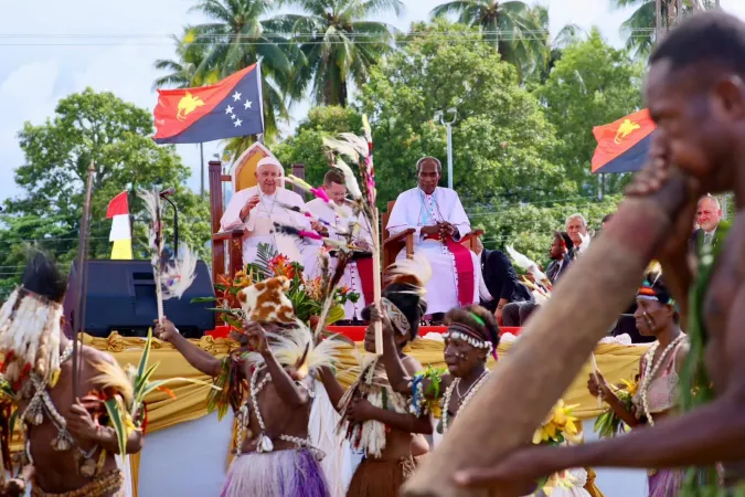 Pope Francis waves at dancers in Vanimo, Papua New Guinea, Sept. 8, 2024.