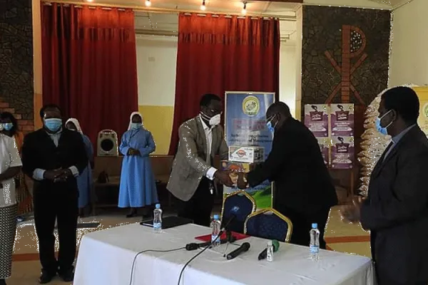 (ZCCB) Representative, Bishop Moses Hamungole receives donation on behalf of the Conference. / Caritas Zambia
