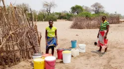 Women fetching water through sand abstraction on drying Nyautande riverbed. Credit: Caritas Zimbabwe